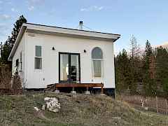 south facing wall of home is 12' tall on the inside, French doors are 6' wide by 8' tall, the space is full of natural light, you always feel connected to the outside